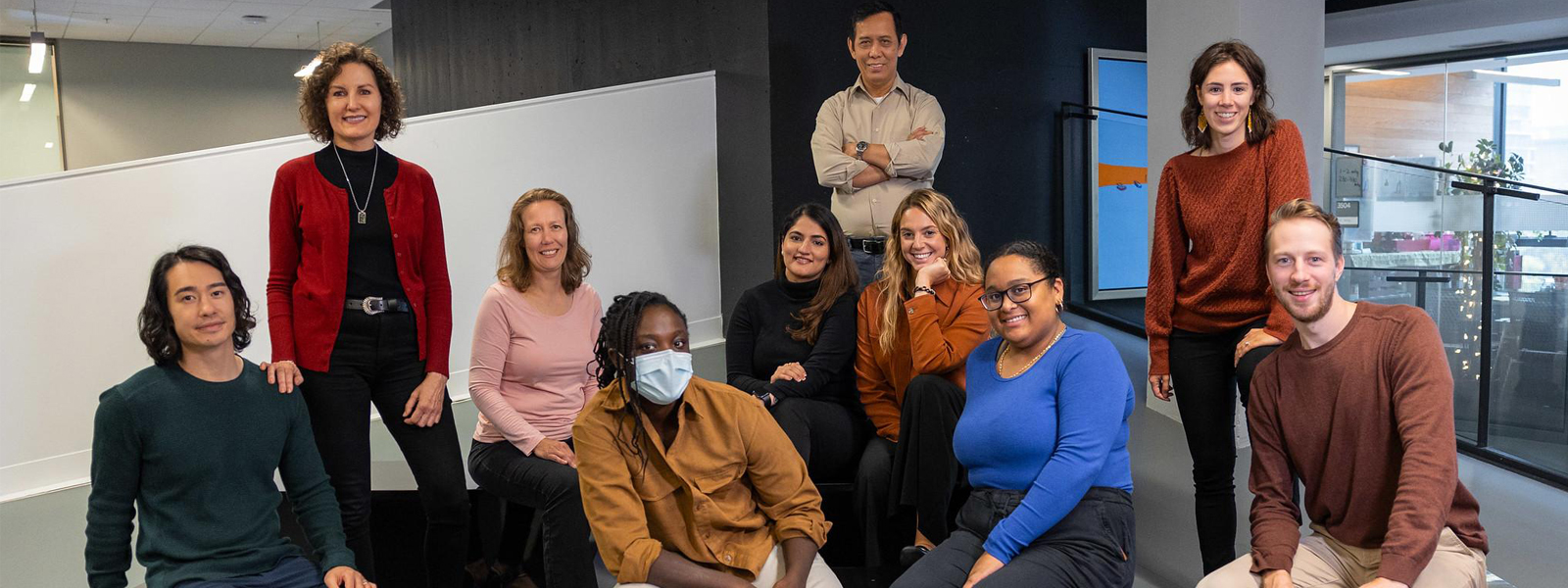 An indoor team photo of the Pharmacists Clinic staff.