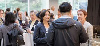 A group of people mingling at the Catalyze: Innovating Nanomedicines event.