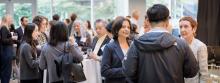 A group of people mingling at the Catalyze: Innovating Nanomedicines event.