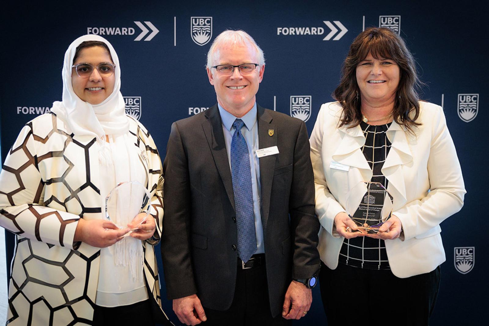 Standing left to right: Dr. Sumreen Javed, Dean pro tem Larry Lynd and Suzanne Solven.