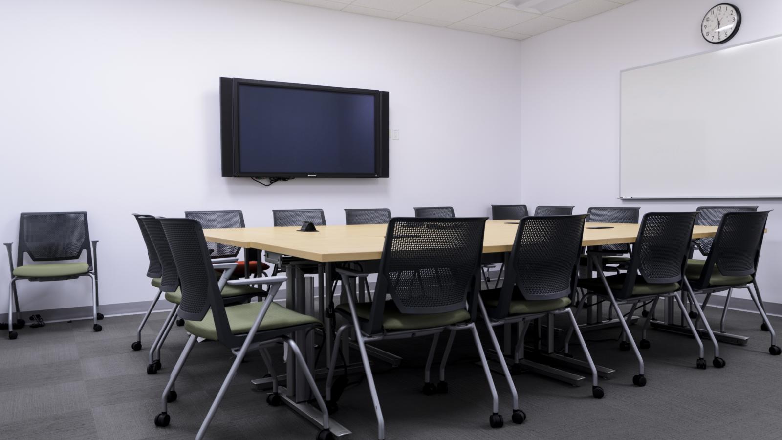 A view of empty, well-lit Room 3102. 