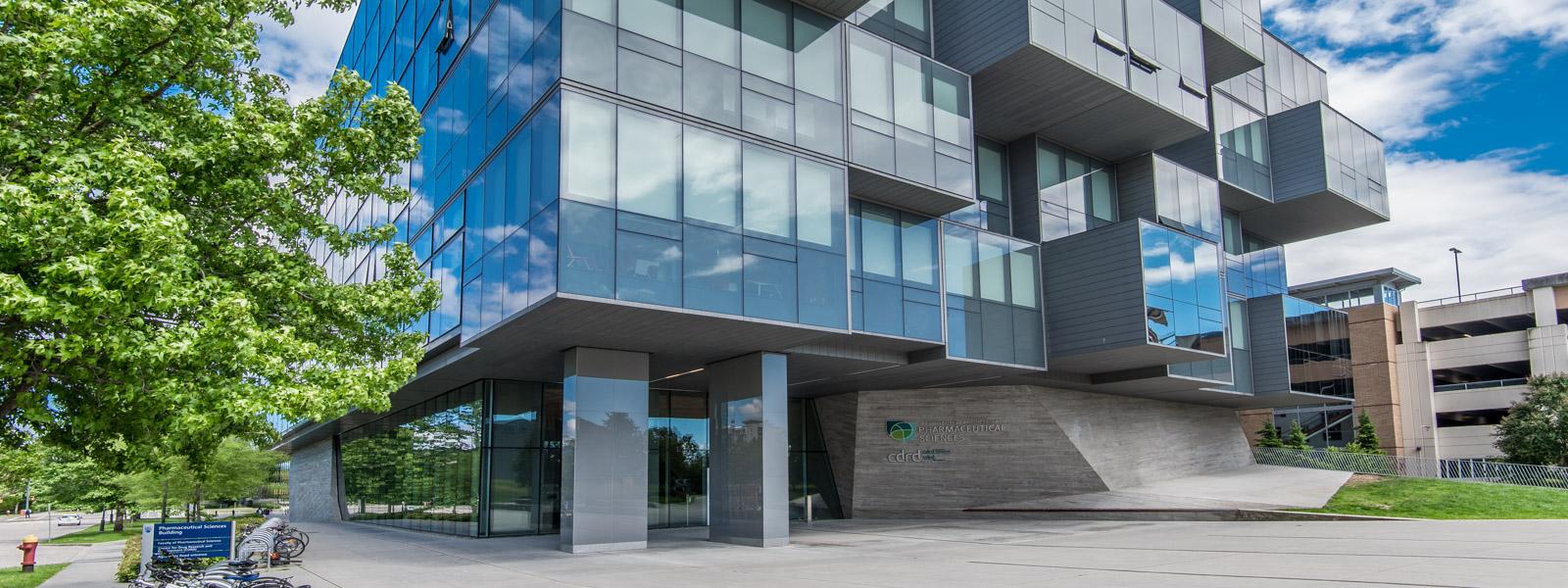 The exterior of the Pharmaceutical Sciences Building on a sunny day.